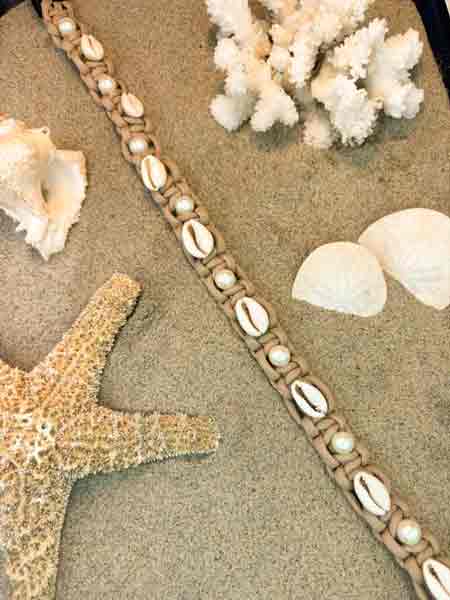 Cowrie & Pearl collar, Sand, flat lay on the beach